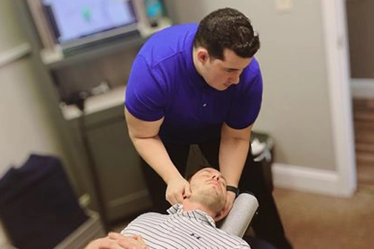 Chiropractor Macon GA Eduardo Emanuel Rivera Adjusting Neck